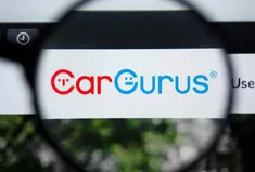 CarGurus logo under magnifying glass
