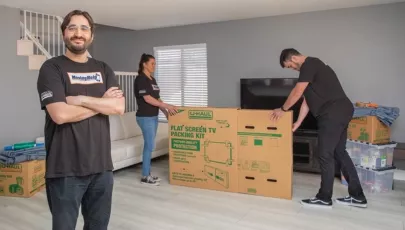 MovingHelp movers pack a tv carefully