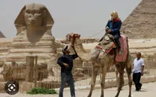 A man rides a camel in Egypt