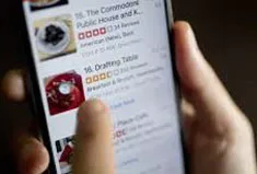 A person checking restaurant reviews on yelp