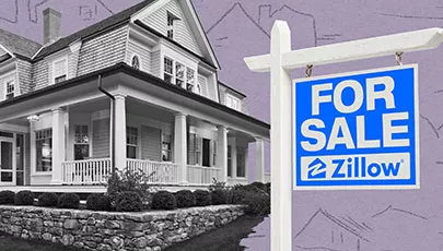 A zillow sold sign in front of a house